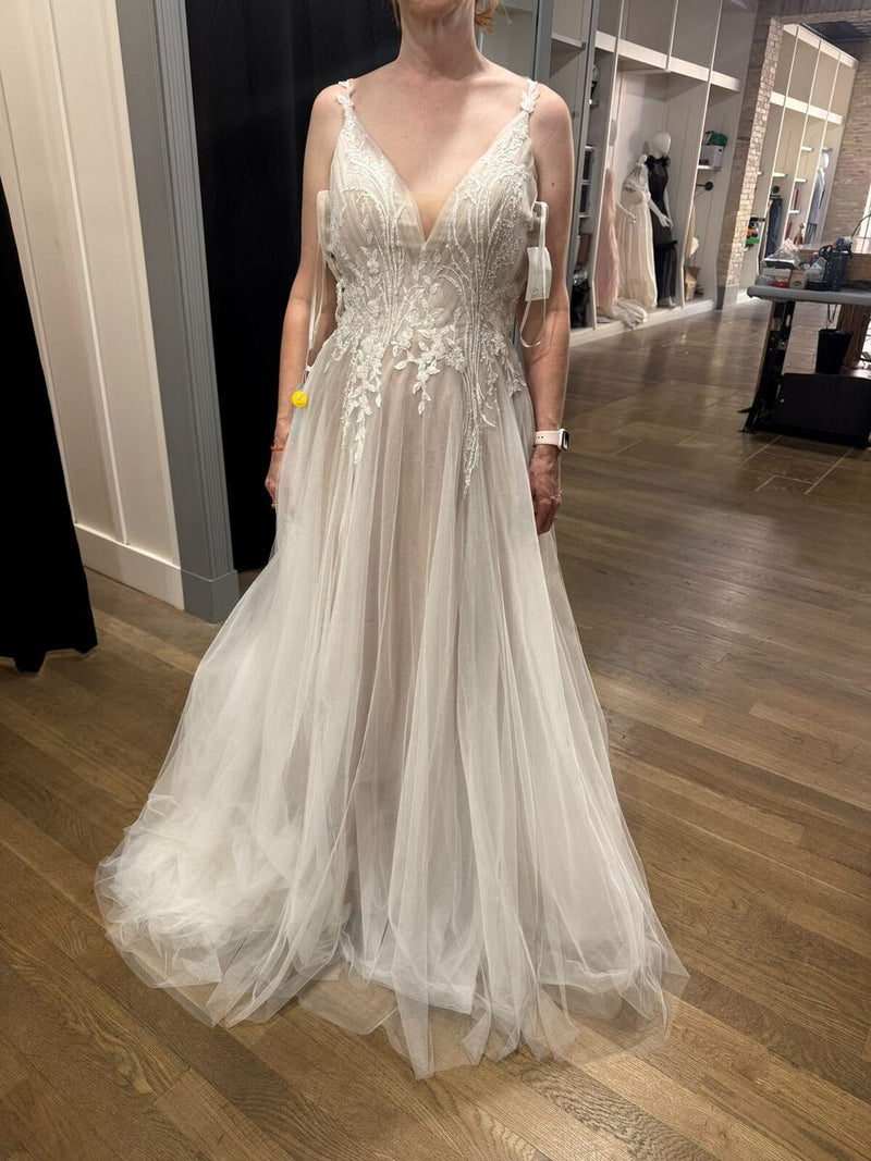 Beaded A-line bridal gown with a tulle skirt