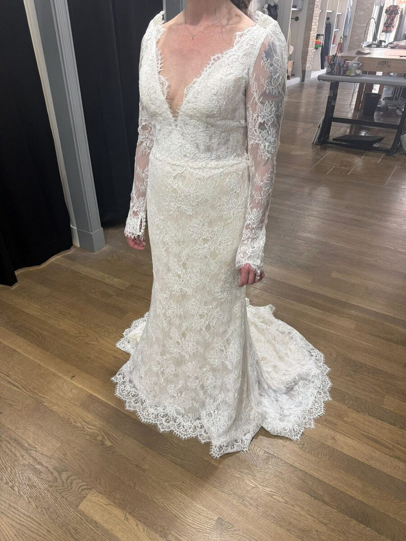 Long sleeve lace mermaid wedding gown fitted to the client