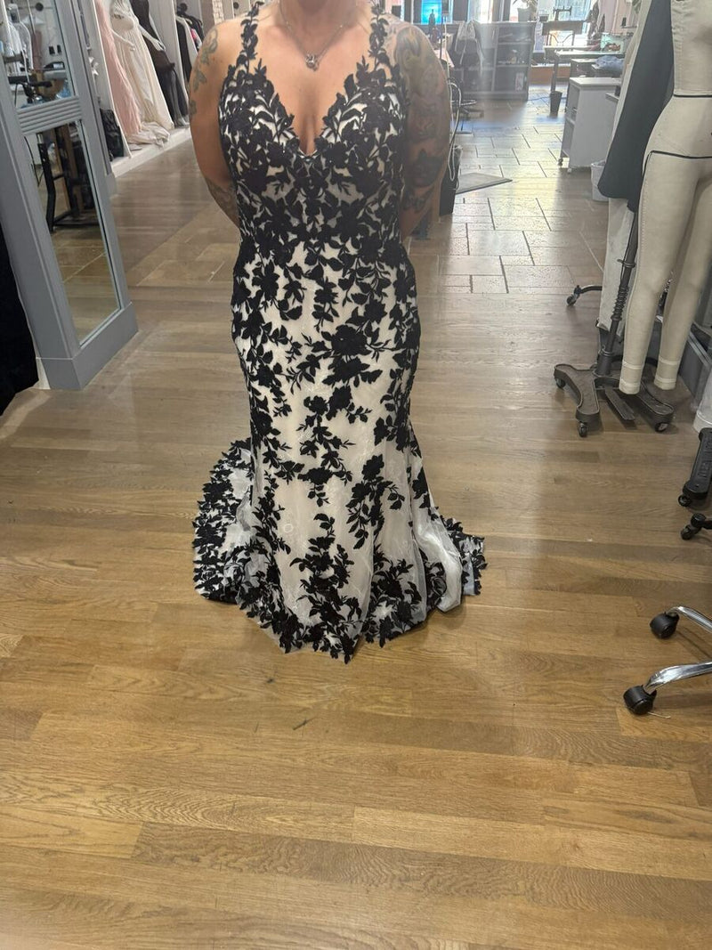 Ivory gown with black floral lace appliqué