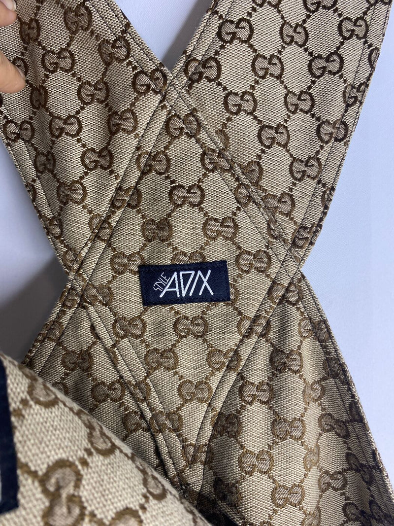 Alterations to a Gucci monogram overall garment